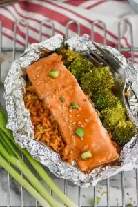 baked teriyaki salmon recipe with broccoli and rice in a foil packet