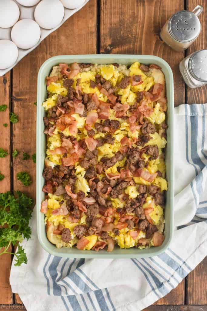 overhead view of breakfast sliders recipe sausage and bacon layer