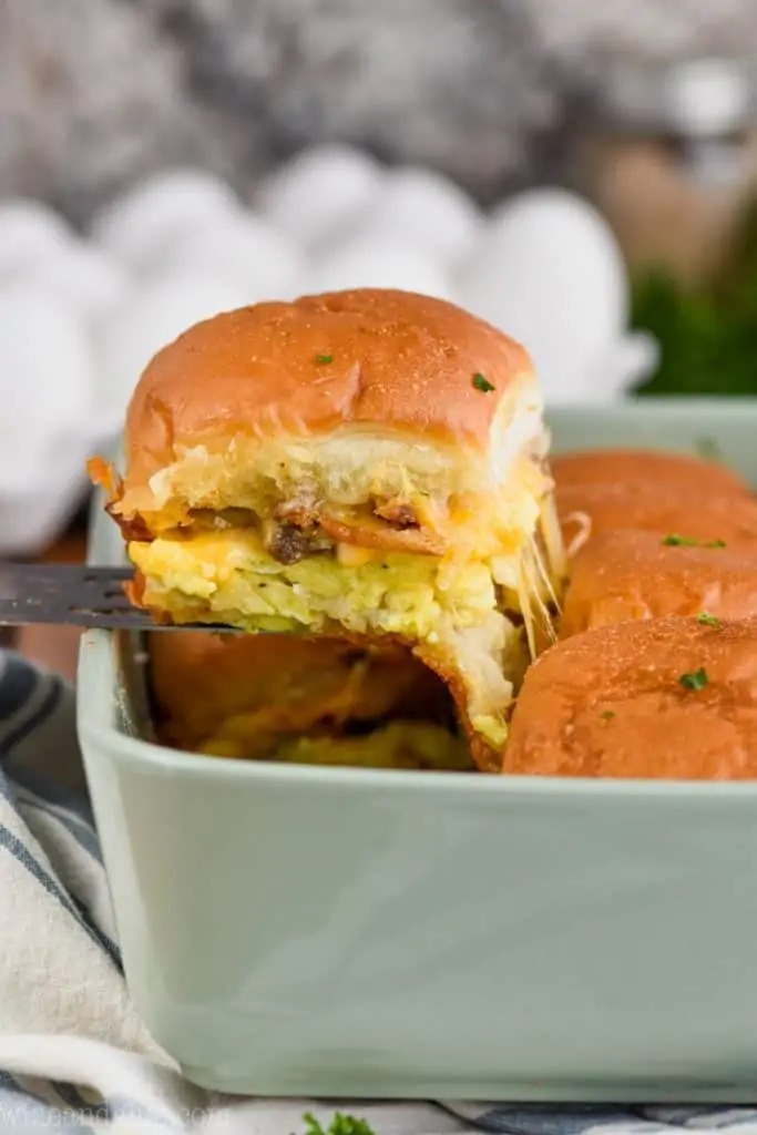 breakfast slider being pulled from casserole dish