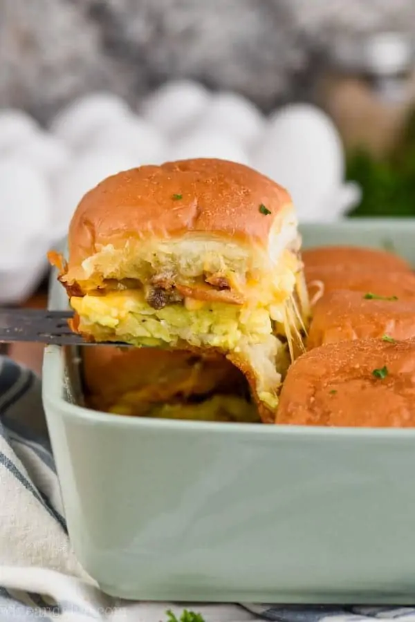 breakfast slider being pulled from casserole dish
