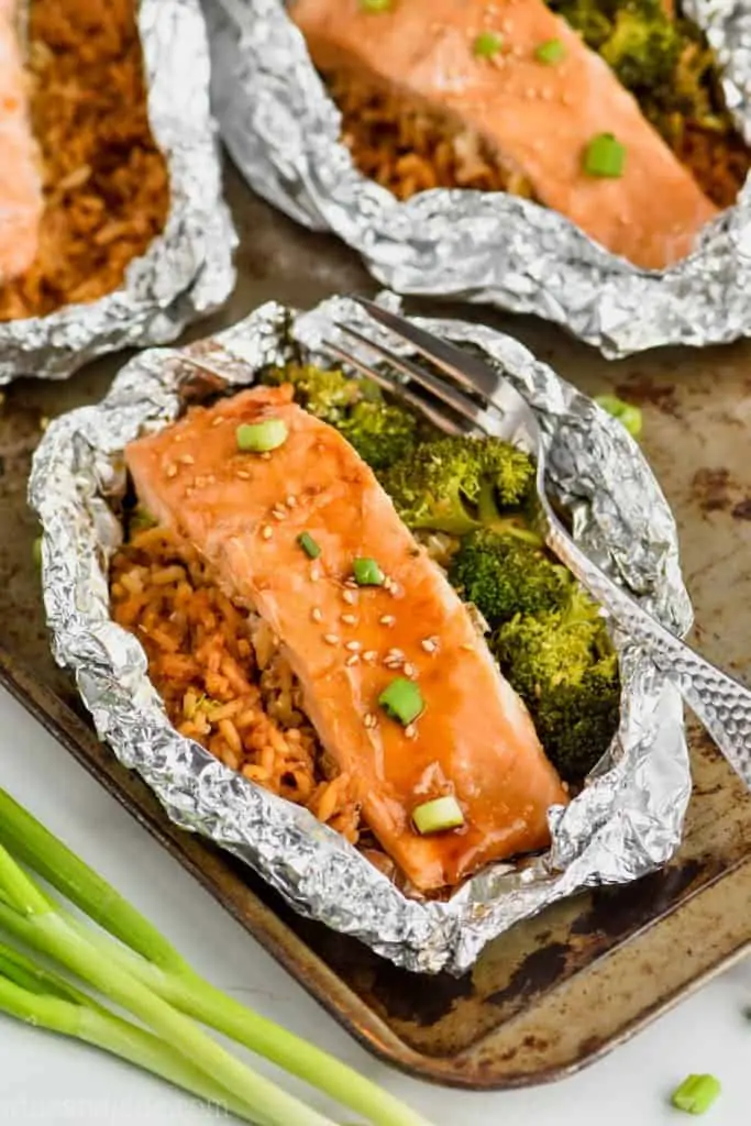 salmon foil packets with broccoli, rice, and teriyaki salmon