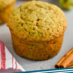 pinterest graphic of a zucchini muffin, says: zucchini muffins simplejoy.com