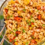 overhead view of a bowl of shrimp fajita pasta salad made with shrimp, vegetables, and bowtie pasta