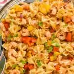 overhead view of a bowl of shrimp fajita pasta salad made with shrimp, vegetables, and bowtie pasta