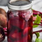 close up of a mason jar filled with refrigerator pickled beets
