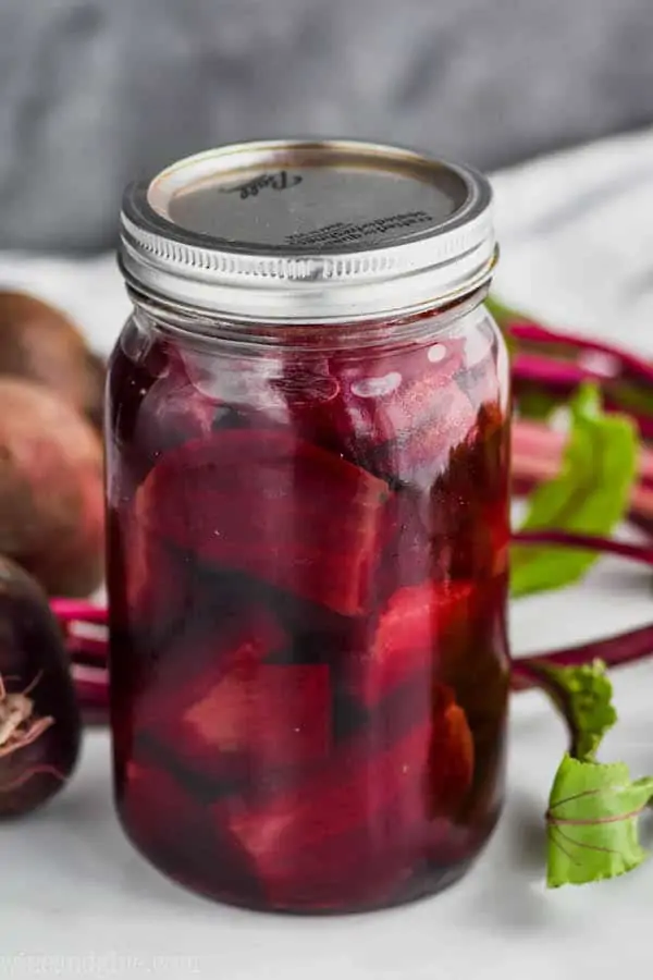 close up of a mason jar filled with refrigerator pickled beets