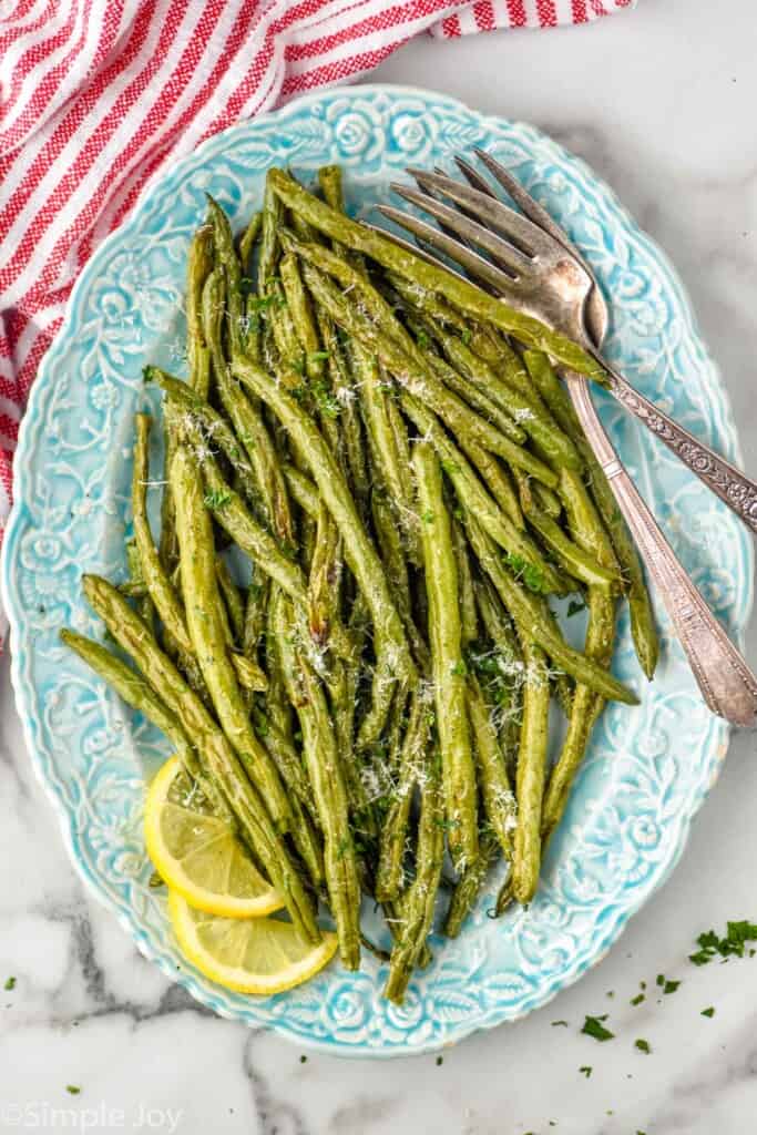 overhead view of a platter full of roasted green beans recipe