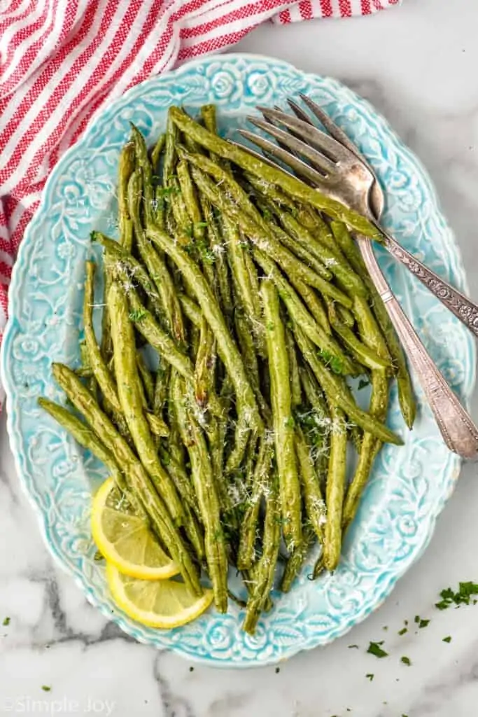overhead view of a platter full of roasted green beans recipe