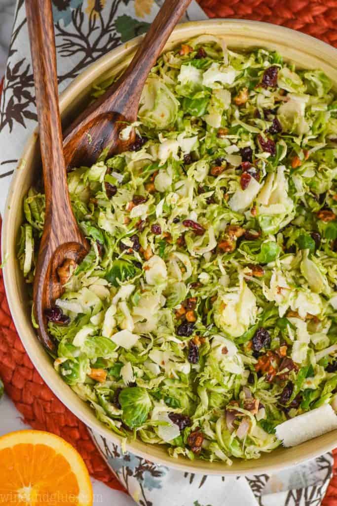 overhead view of shaved brussel sprout salad recipe tossed with citrus dressing