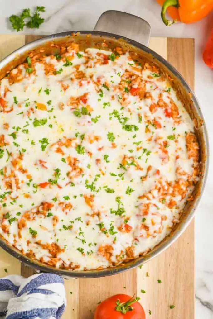 overhead of a skillet of stuffed pepper casserole garnished with parsley