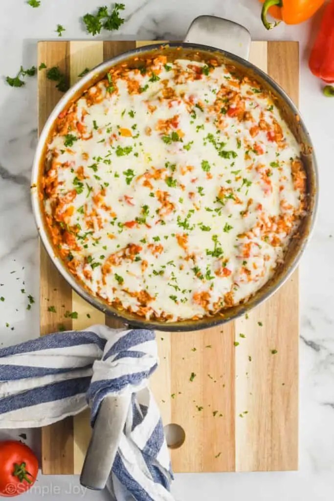 overhead of a skillet of stuffed pepper casserole recipe on a cutting board