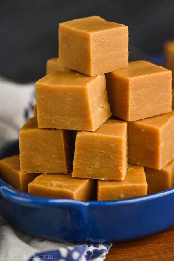 a pile of easy peanut butter fudge in a small blue dish