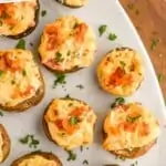 pinterest graphic of overhead of easy stuffed mushrooms on a platter