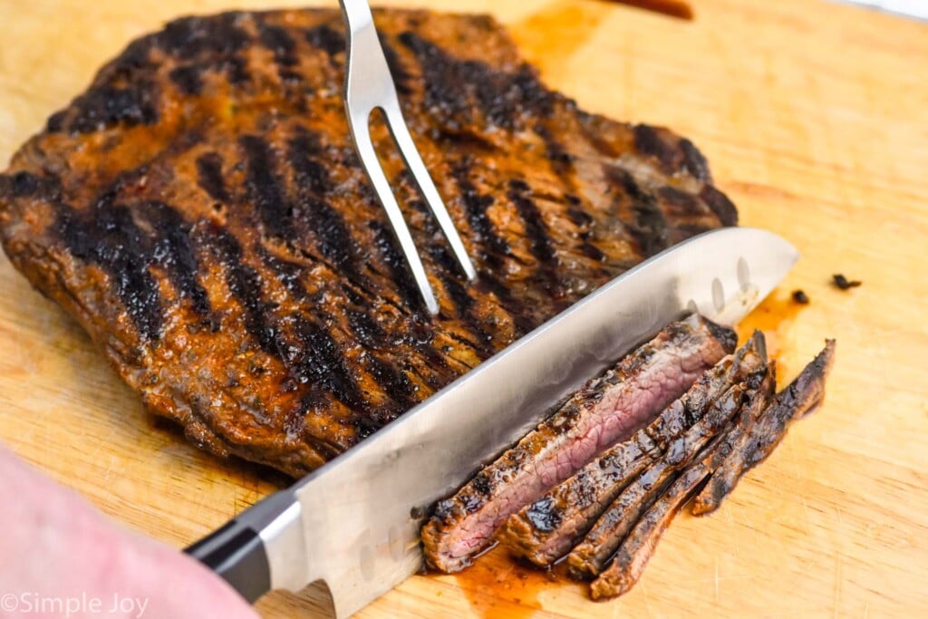 Overhead photo of steak being cut for Steak Fajitas recipe.