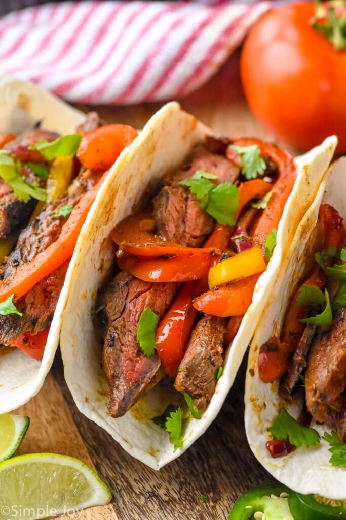 Overhead photo of Steak Fajitas served in tortilla shells.