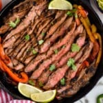 Overhead photo of Steak Fajitas in a cast iron skillet. - 21
