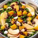 Bowl of Winter Salad topped with cranberries and goat cheese. - 9