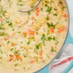 Pinterest graphic of overhead of a stock pot full of creamy chicken noodle soup