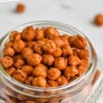 pinterest graphic of small mason jar full of roasted chickpeas, says: "amazing roasted chickpeas, simplejoy.com"