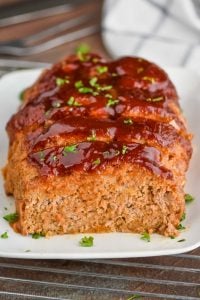 front view of a ground turkey meatloaf that has been sliced into and looks super moist
