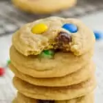 stack of six mm cookies with the top one missing a bite