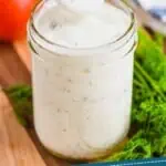 pinterest graphic of small wooden spoon lifting out of a mason jar of ranch dressing, says: "homemade ranch dressing simplejoy.com"