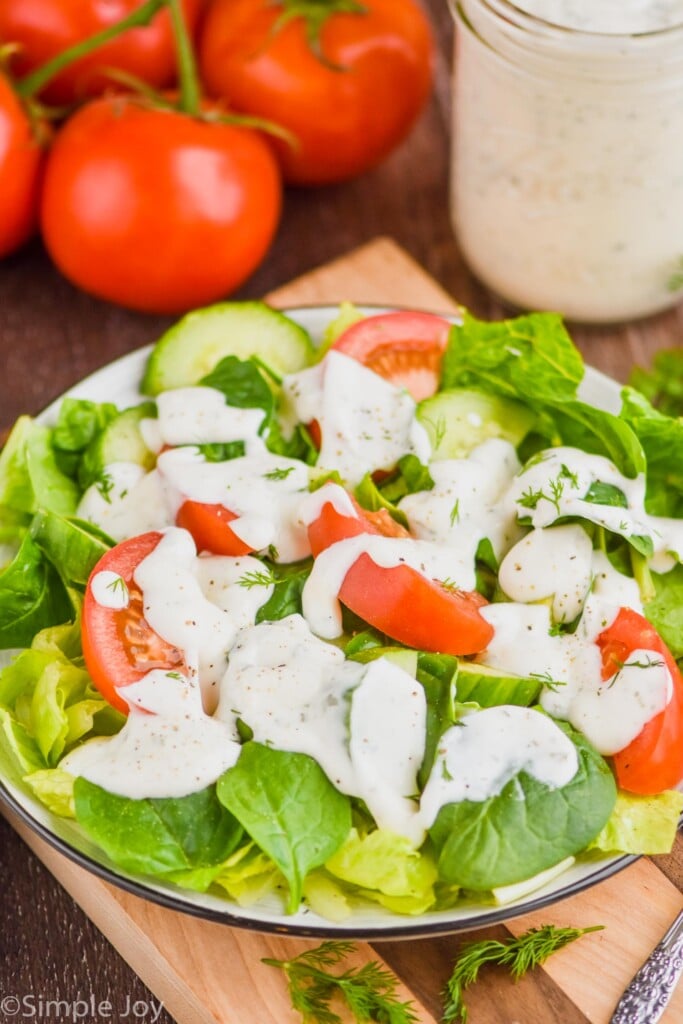 side view of a garden salad topped with the best ranch dressing