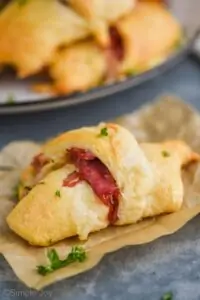 close up of a crescent roll made with corned beef to make it a reuben crescent roll