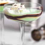 pinterest graphic of a grasshopper cocktail in a coup glass with chocolate garnishing the glass and whipped cream on top, says: "the perfect grasshopper, simplejoy.com"
