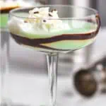 pinterest graphic of a grasshopper cocktail in a coup glass with chocolate garnishing the glass and whipped cream on top, says: "the perfect grasshopper, simplejoy.com"