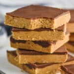 stack of five peanut butter chocolate bars, top one has a bite out of it - 23