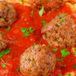 pinterest graphic of up close picture of Italian Meatballs says, "grandma's italian meatballs, simplejoy.com"