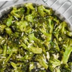 overhead bowl of roasted broccoli with parmesan, says: "the best roasted broccoli simplejoy.com"