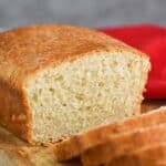 a loaf of sandwich bread cut in the middle with slices coming towards the camera - 14