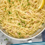 pinterest graphic of overhead of a skillet full of clam linguine, says "clam linguine simplejoy.com"