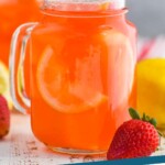pinterest graphic of a mason jar glass of strawberry lemonade that says "strawberry lemonade simplejoy.com"