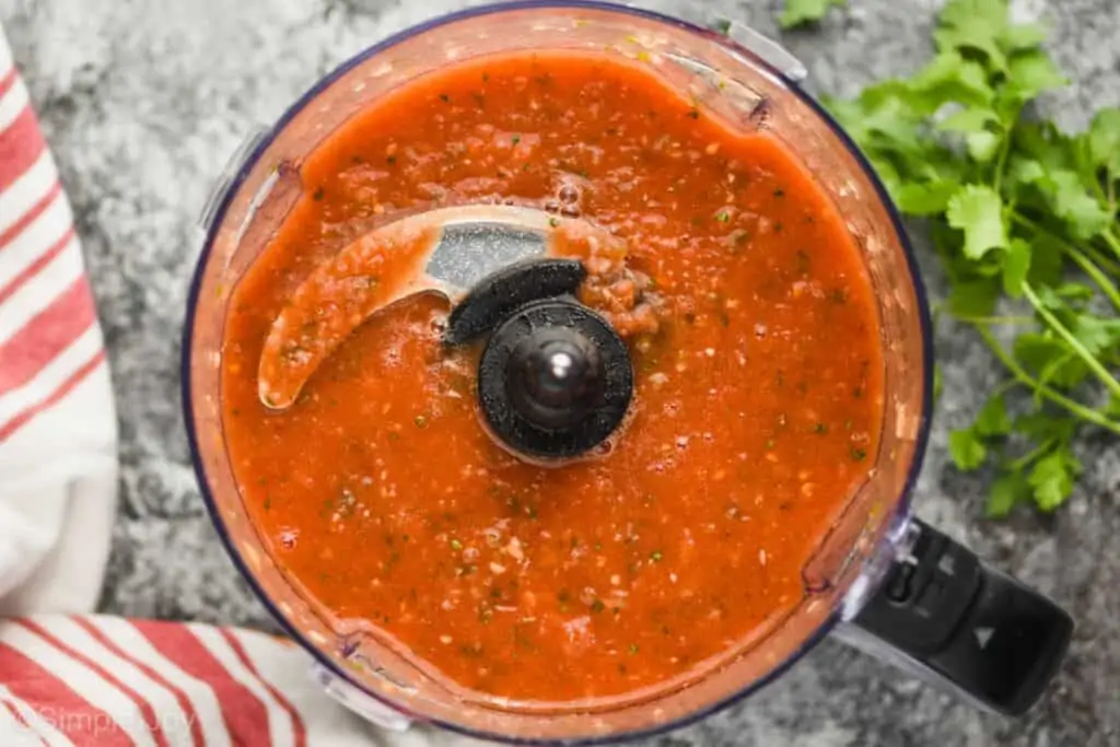 overhead view of a salsa recipe that has been blended up and is thin