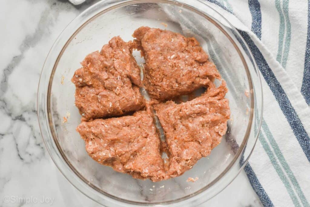 turkey burger recipe divided into equal parts in a bowl ready to form into patties