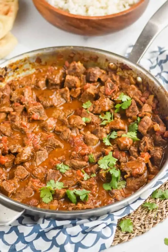 a skillet with beef curry