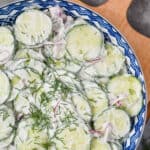 overhead view of a creamy cucumber salad and onion salad