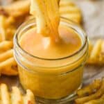 a waffle fry dipping into chick fil a sauce - 23