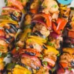 close up of chicken kabobs with graphics over the photo to tell the recipe title
