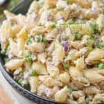 a tuna pasta salad in a bowl garnished with fresh dill - 27