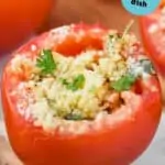 a baked stuffed tomato garnished with fresh parsley