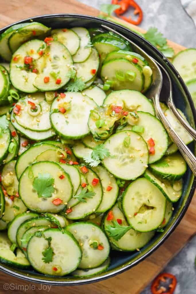 overhead of a bowl of asian cucumber salad made with thinly sliced cucumbers