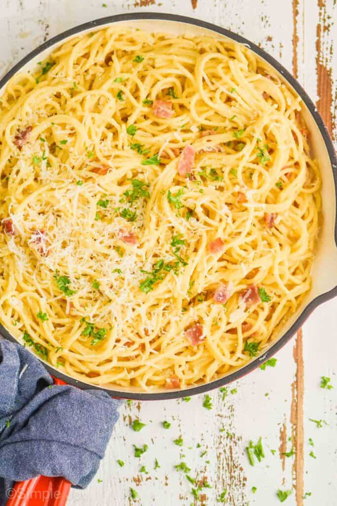 close up overhead view of a skillet full of pasta alla carbonara