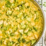 overhead view of a chicken and broccoli casserole in a skillet garnished with fresh parsley - 6