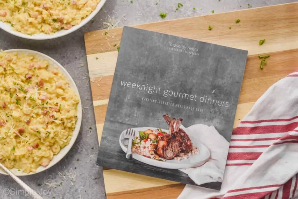 overhead of a cookbook sitting on a cutting board