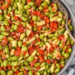 overhead view of an edamame salad, made and mixed, coated with dressing - 6