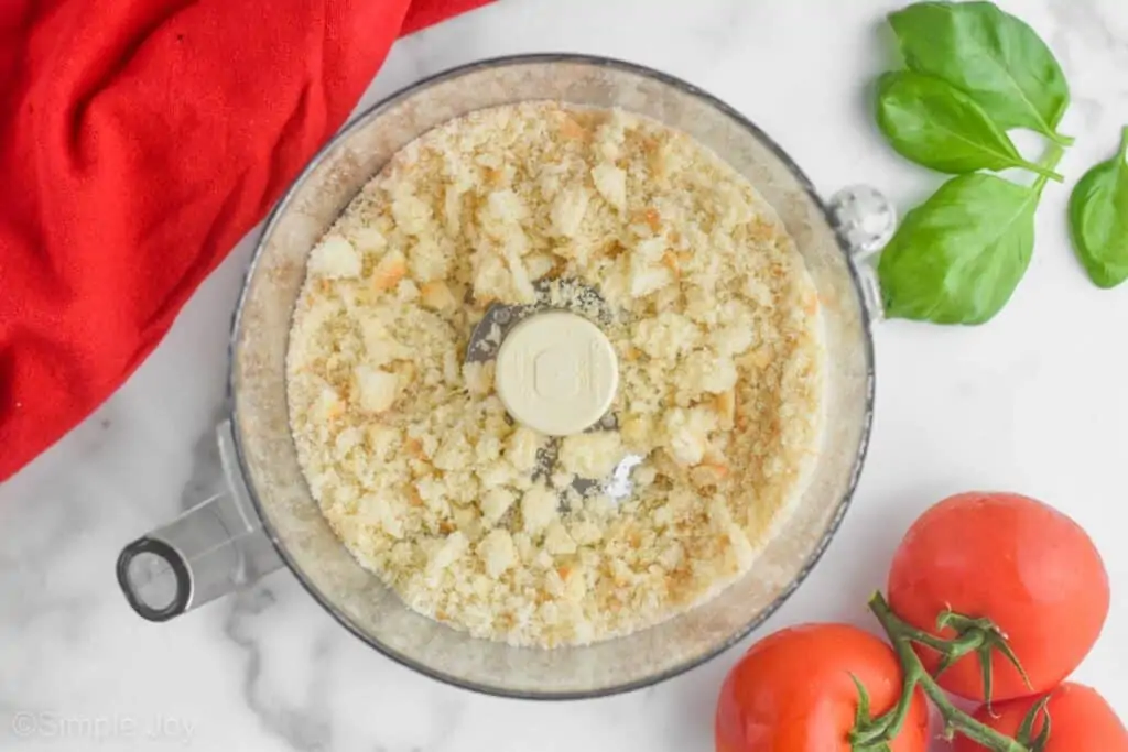 overhead photo of fresh bread crumbs made from bread in a food processor that are large crumbs